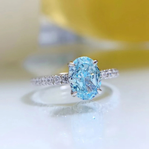 0.75 Carat Oval Shaped Aquamarine And Round Natural Diamond As a Sidestone Engagement Ring