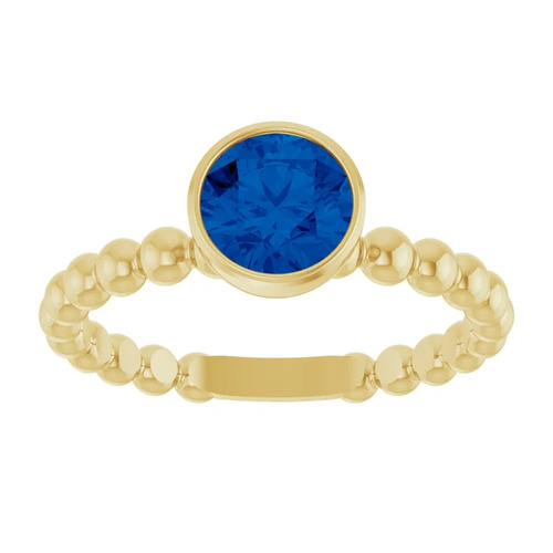 0.6 Ct Blue Sapphire Round Cut Aunika  in 9K White Gold